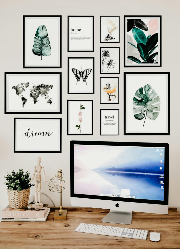 15 Neutral Office Decor Ideas That Feel Calm, Curated, and Intentional neutral office art print gallery wall with botanical and minimalist prints in warm beige tones